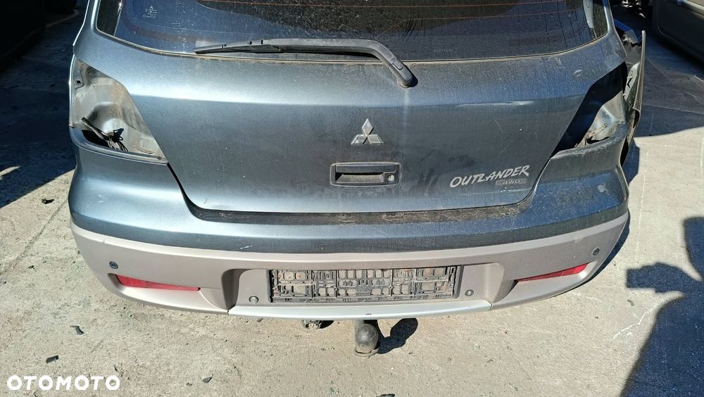 ZDERZAK TYŁ TYLNI TYLNY MITSUBISHI OUTLANDER I