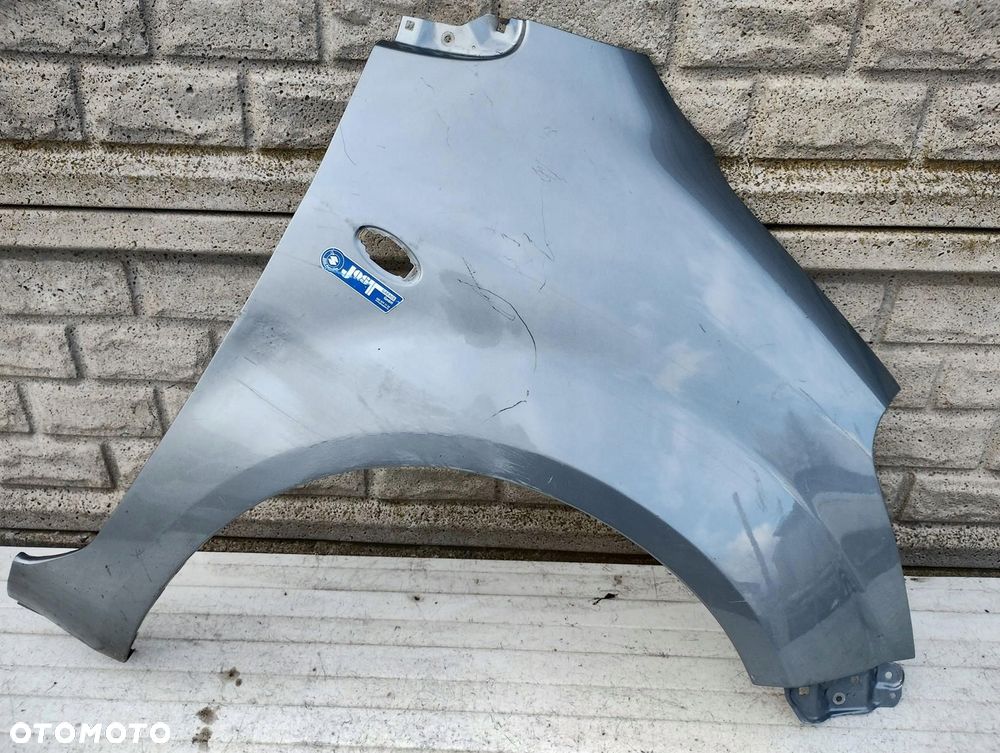 SUZUKI SPLASH 2007-2017 BŁOTNIK PRZEDNI PRAWY ORYGINAŁ - 1