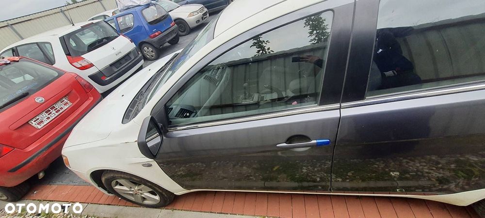 DRZWI LEWY PRZÓD MITSUBISHI LANCER VIII UK - 1