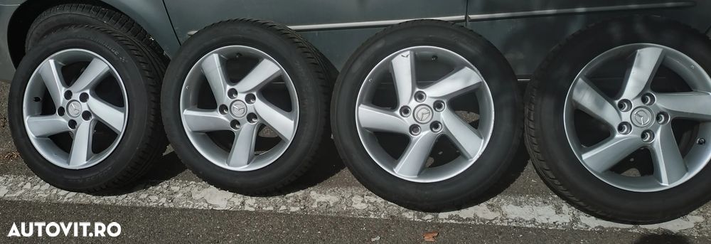 Set 4 jante aliaj PCD 5/114.3 mm, CB 54 mm, cu anvelope vară noi Riken 205/55 R16 94V Road Performance - 1