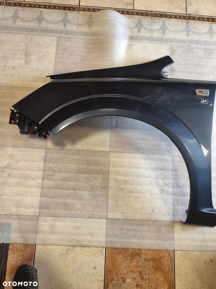 Błotnik Lewy Opel Zafira B Kod Lakieru Z168