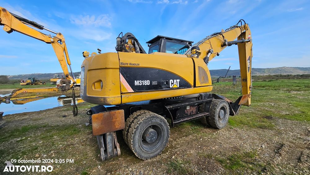 Caterpillar CAT 318 D Excavator pe roti - 8