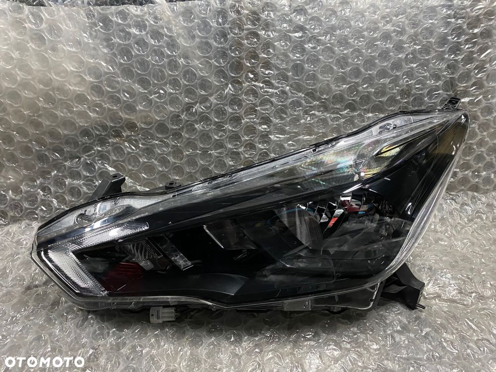 LAMPA LEWA ZWYKŁA CZARNA NISSAN MICRA K14 26060 5FA08 KOITO 100-18728 - 4