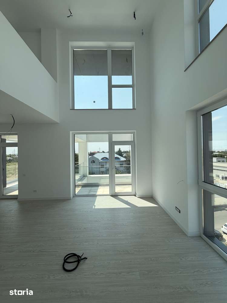 Apartament tip duplex cu balcoane generoase — fotografia 3