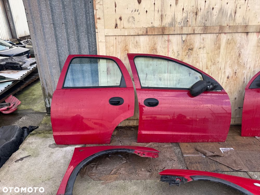 Opel Corsa c czerwone bordowe drzwi przednie przód prawe lewe maska lampy przód przednie lampy tył tylnie maska błotnik prawy lewe lampy tył belka przód - 2