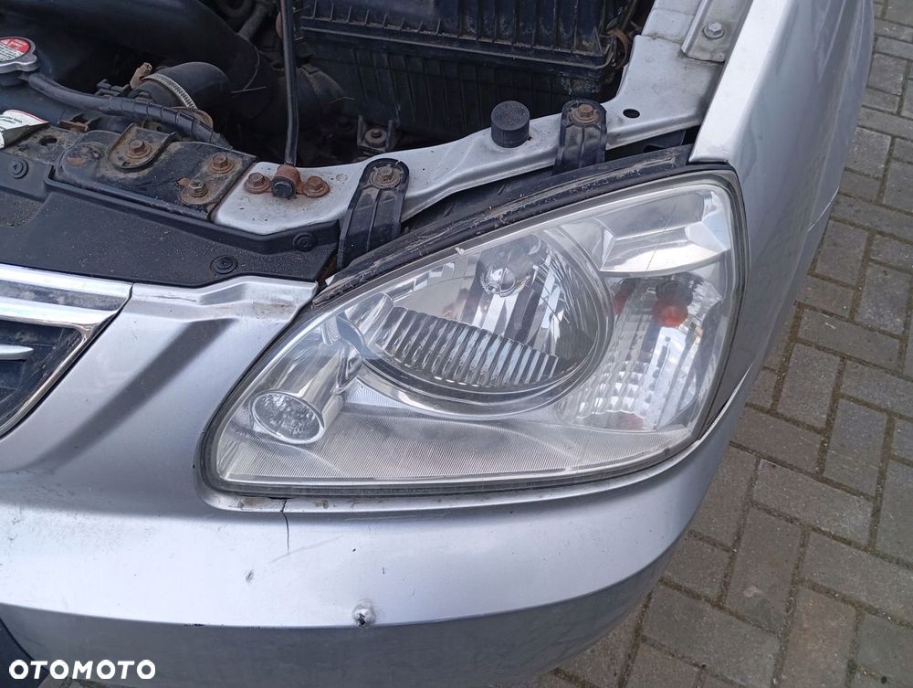 KIA CARENS II LAMPA LEWA PRZEDNIA PRZÓD EU