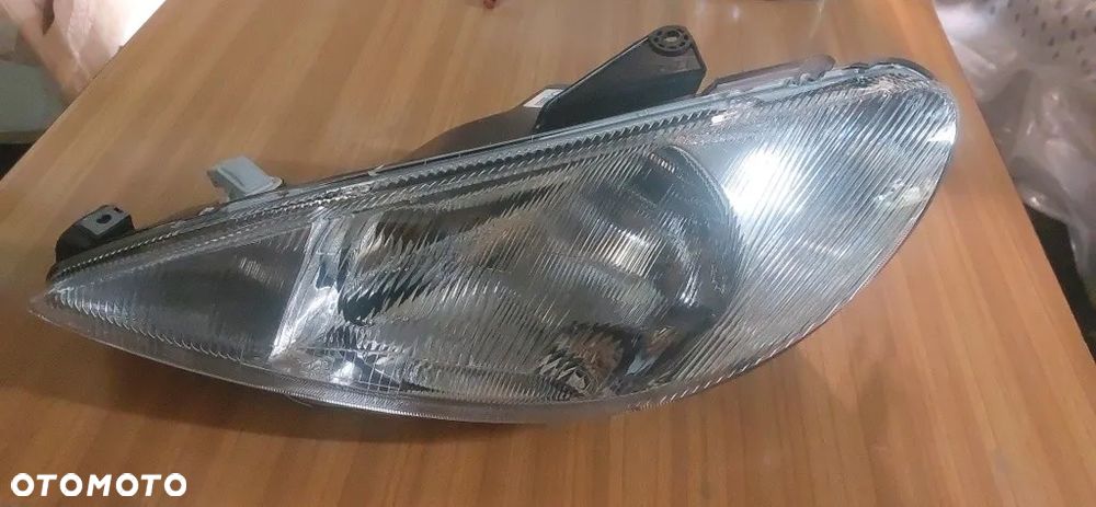 Peugeot 206 Reflektor Lewy 572309-V - 1