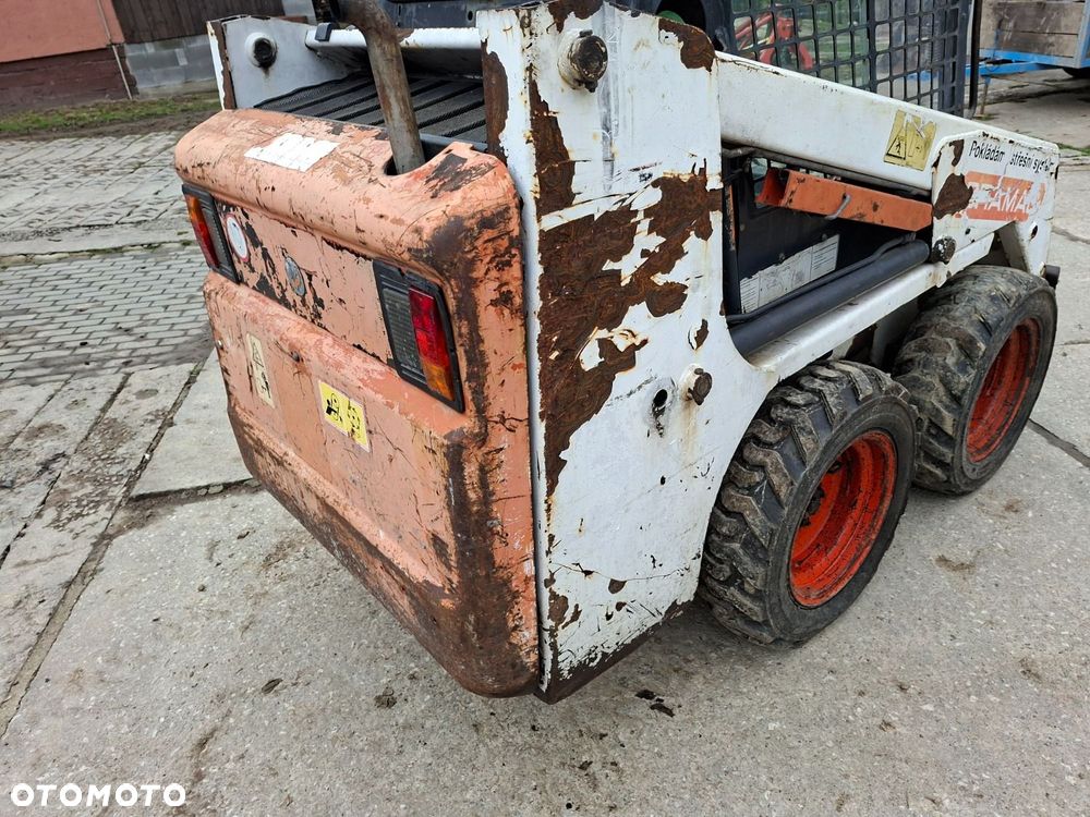 Bobcat 553 4X4 + Melroe Ingersoll-Rand 725S B/H - 26