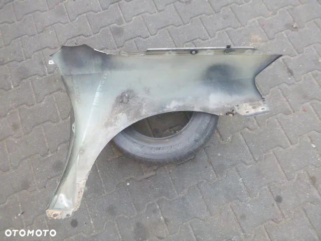 BŁOTNIK LEWY PRZÓD LEWY PRZEDNI OPEL ASTRA II G - 14