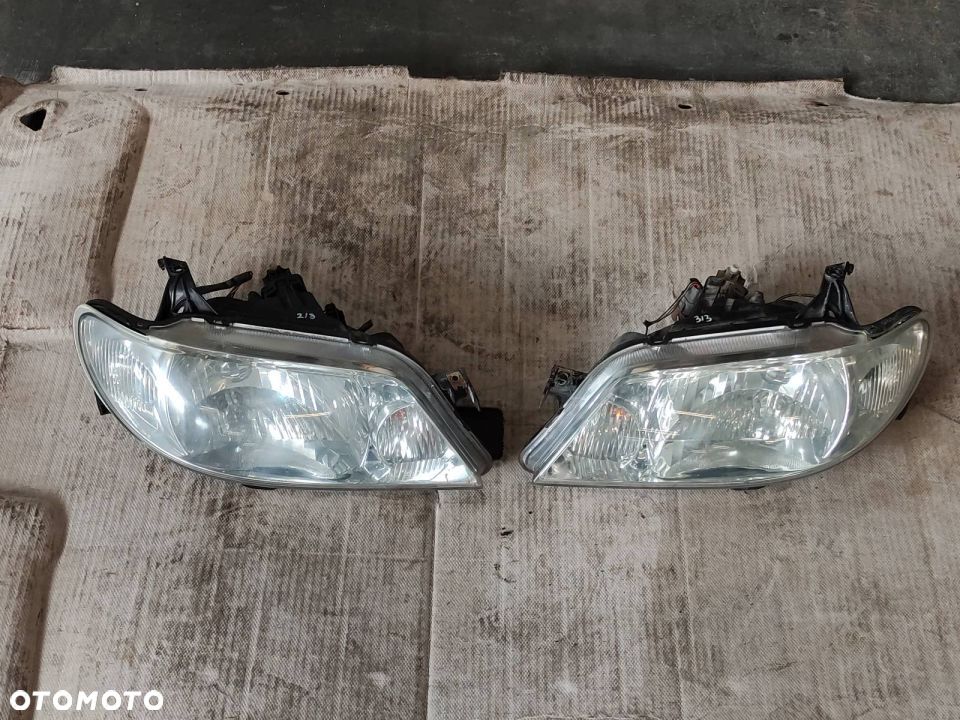 ZDERZAK + LAMPY MAZDA 323 BJ - 16