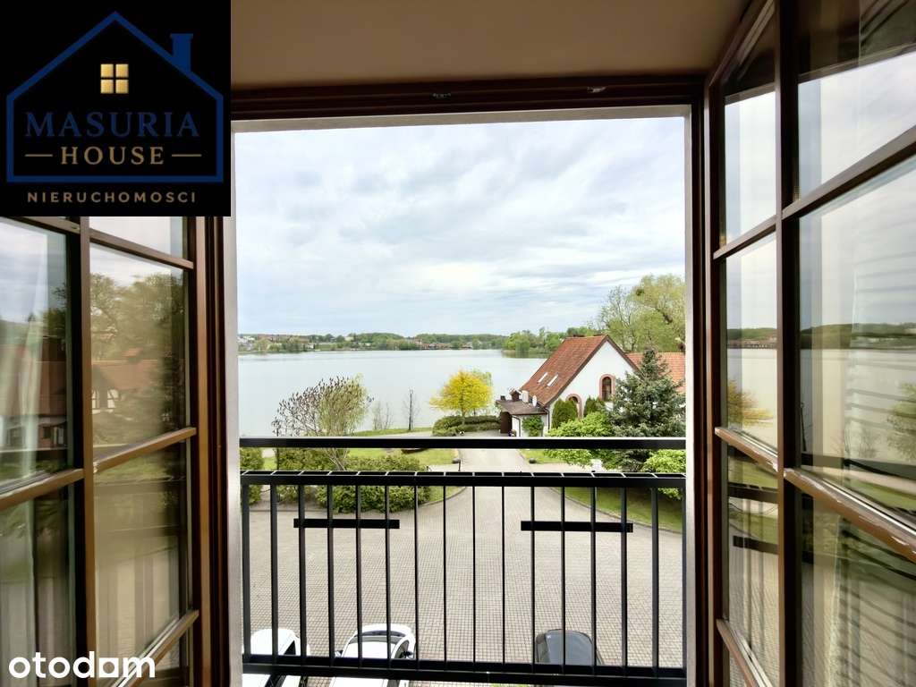 Apartament nad jeziorem z miejscem postojowym