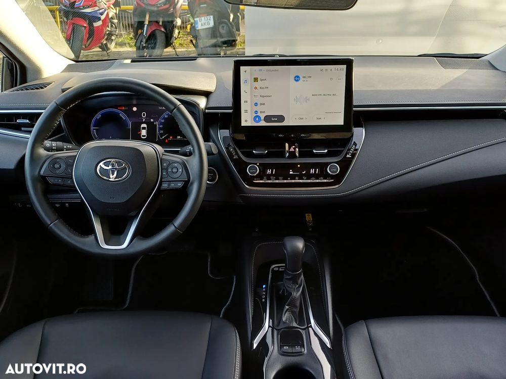 Toyota Corolla TS 1.8 HSD Exclusive - 13