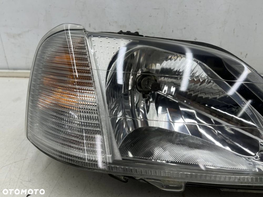 Lampa reflektor Dacia Logan I 04-08r. PRAWA  przednia zwykła prawy przód 8200211006 - 4