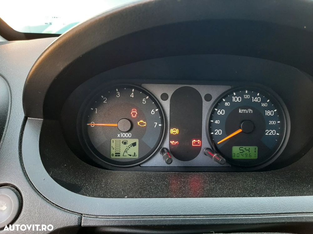 Ford Fiesta 1.4i Ghia - 11