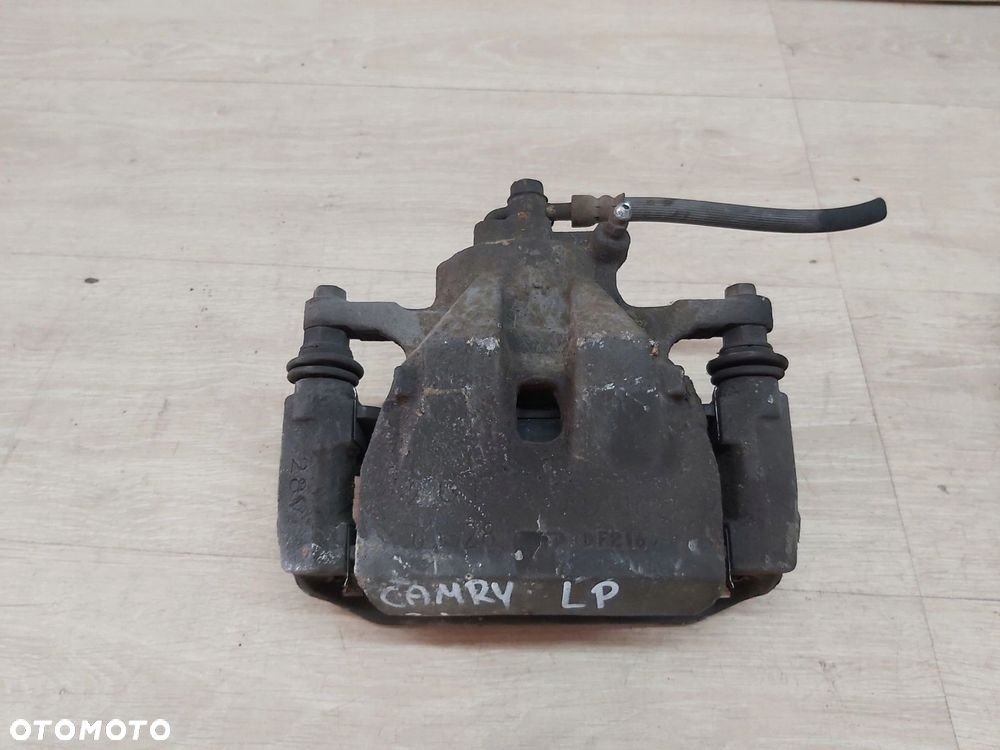 TOYOTA Camry VI XV40 zacisk jarzmo lewy przód 06-11r - 2