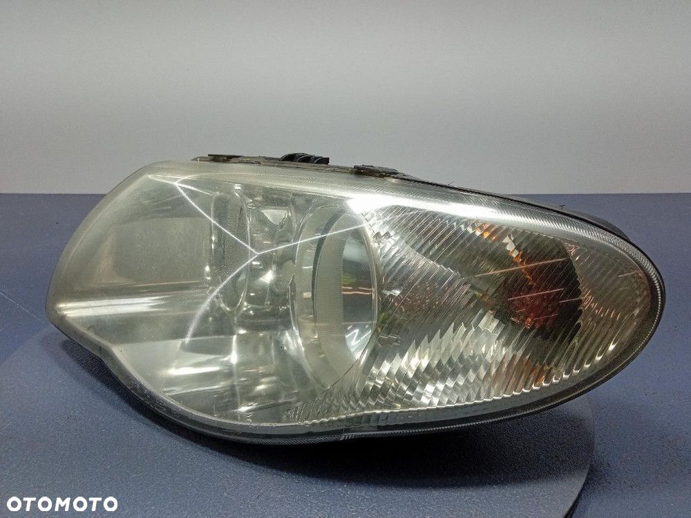 CHRYSLER GRAND VOYAGER LIFT 04- REFLEKTOR LEWY PRZÓD LAMPA EU 04857831AB - 2