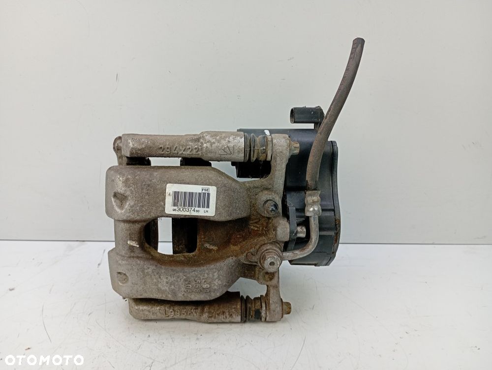 Zacisk Hamulcowy Tylny Lewy Tył Elektryczny Scudo III Jumpy Expert III Vivaro C 9830037480 - 1