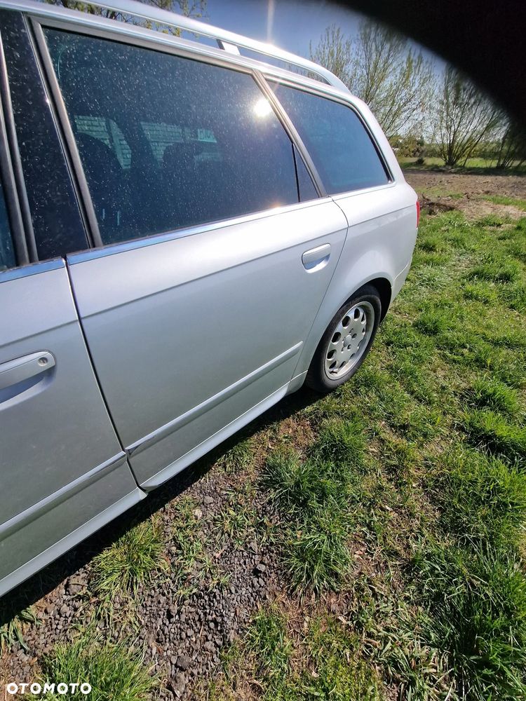 Drzwi  lewy tył  seat  exeo  w  kolorze  LX7W - 1
