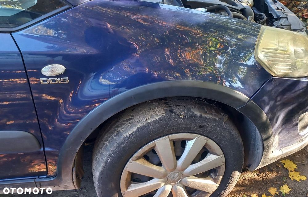BŁOTNIK PRZEDNI PRAWY SUZUKI SX4 ZCH