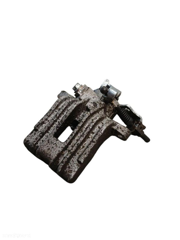 ZACISK HAMULCOWY LEWY TYŁ VW GOLF IV ZACISK HAMULCOWY LEWY TYŁ GOLF IV - 1