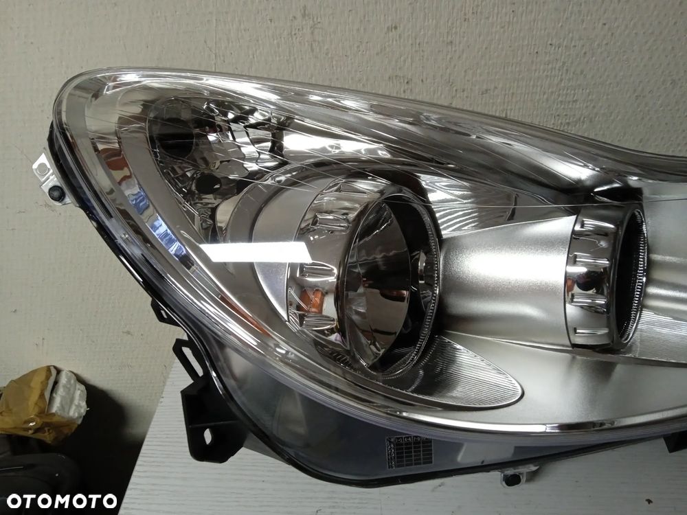 REFLEKTOR OPEL CORSA D LEWY LUB PRAWY NOWY - 8