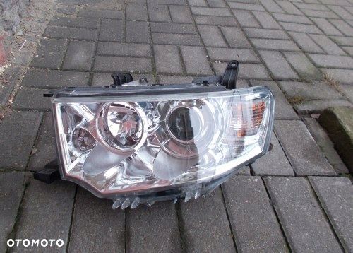 MITSUBISHI PAJERO SPORT L200 SOCZEWKA H7 LEWA PRZEDNIA LAMPA ORYGINAŁ - 1