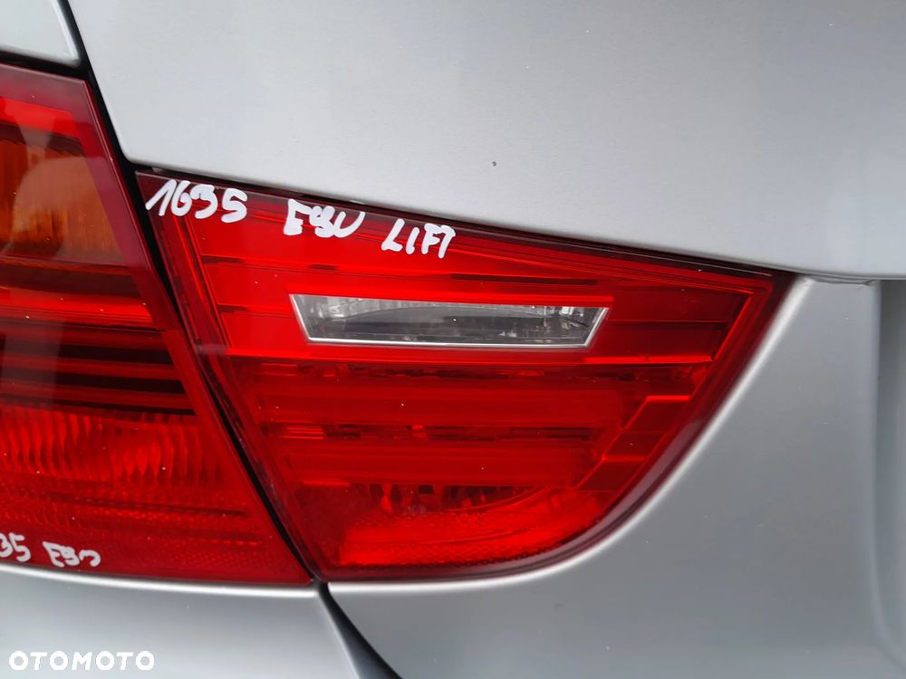 BMW E90 LAMPA LEWA TYLNA LEWY TYŁ W KLAPE - 1