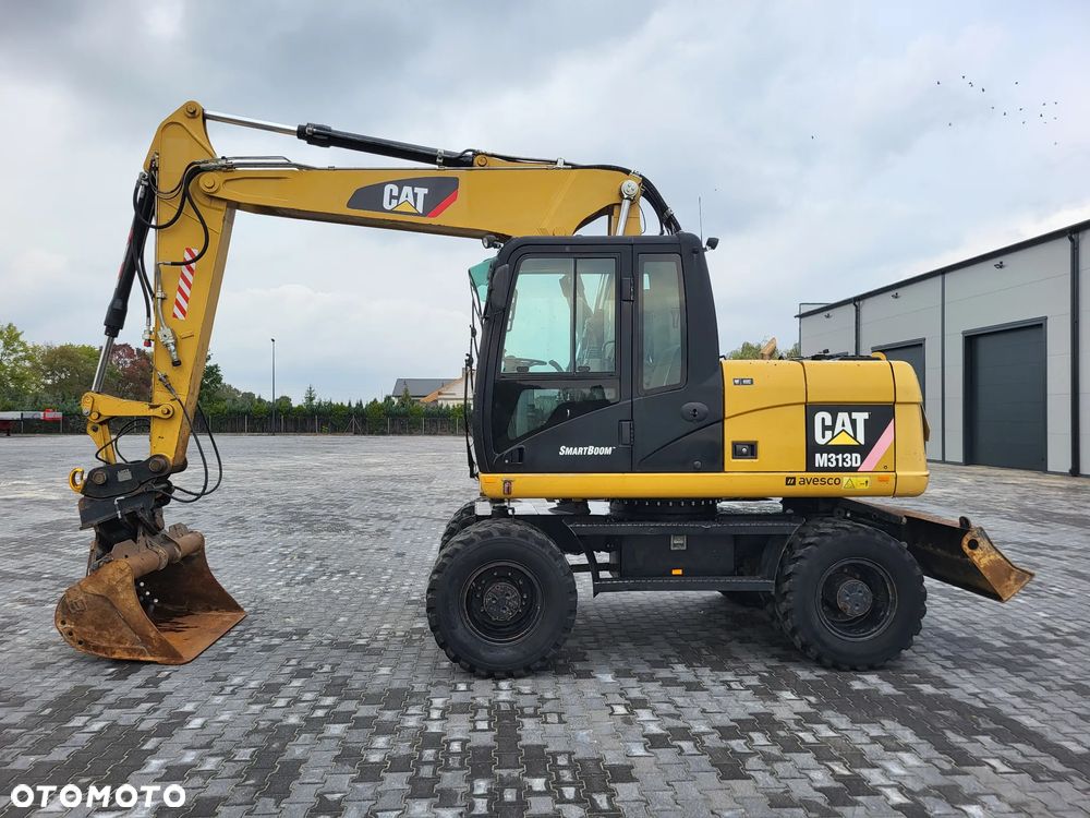 Caterpillar M 313 D / Stan idealny / - 2