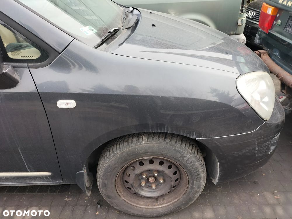 KOMPLET FOTELI  SKÓRZANYCH PRZÓD TYŁ 3 RZĄD KIA CARENS III 06-12r KOD LAK. 1U - 17