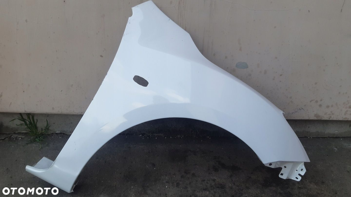 Blotnik prawy przod MAZDA 3 III 08-13r - 2
