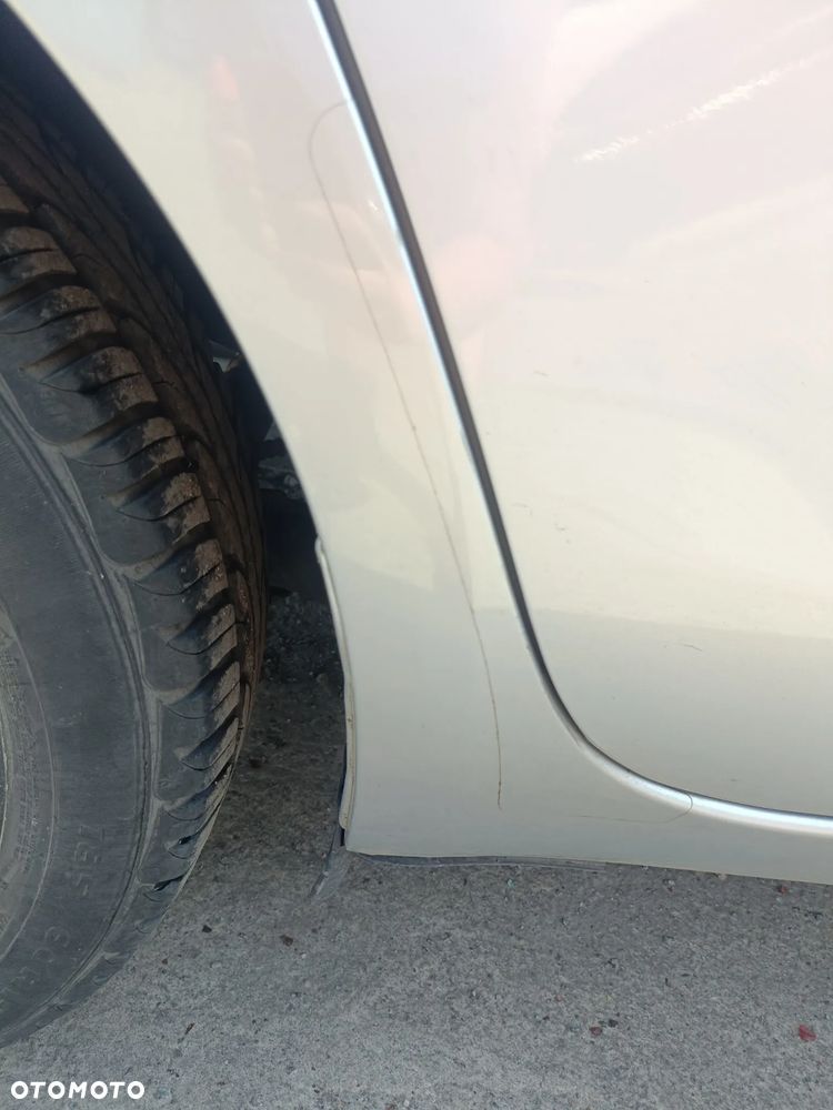 TOYOTA YARIS II 05-11 LIFT 2009 r. 1E7 5D HB błotnik ćwiartka prawy tył PT - 3