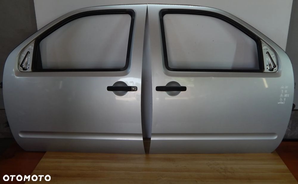 Drzwi przód przednie Nissan Pathfinder R51 Navara D40 05-12 KL0 srebrny Łuków części - 1