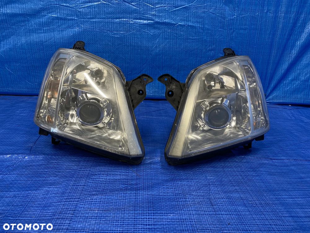LAMPY LAMPA LEWA PRAWA LEWY PRAWY PRZÓD PRZEDNIA XENON KSEON OPEL MERIVA A LIFT 93321054 93321055 EUROPA ORYGINAŁ - 1