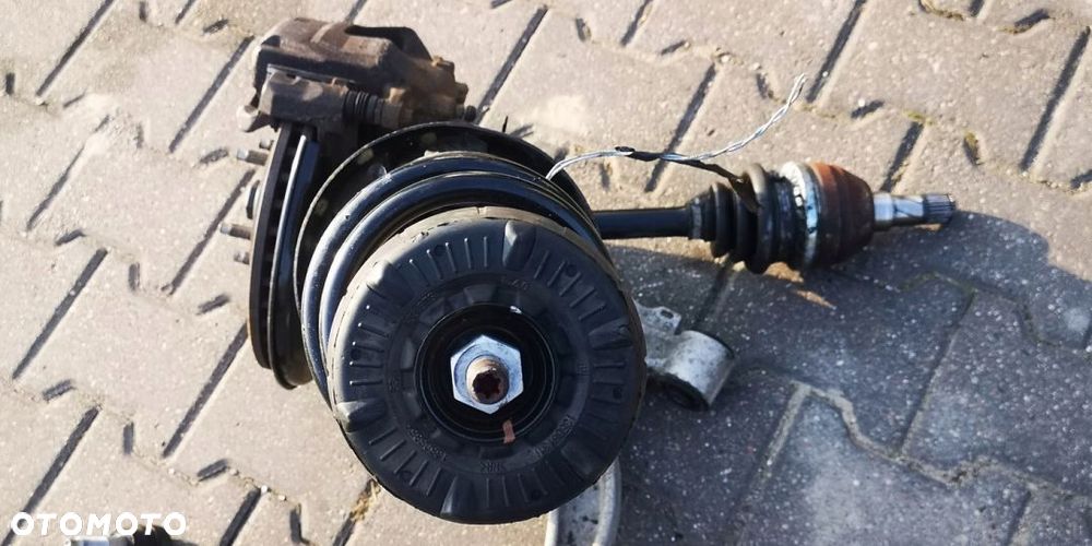 ZACISK WAHACZ LEWY PRZÓD OPEL ASTRA IV J 1.4i TB - 9