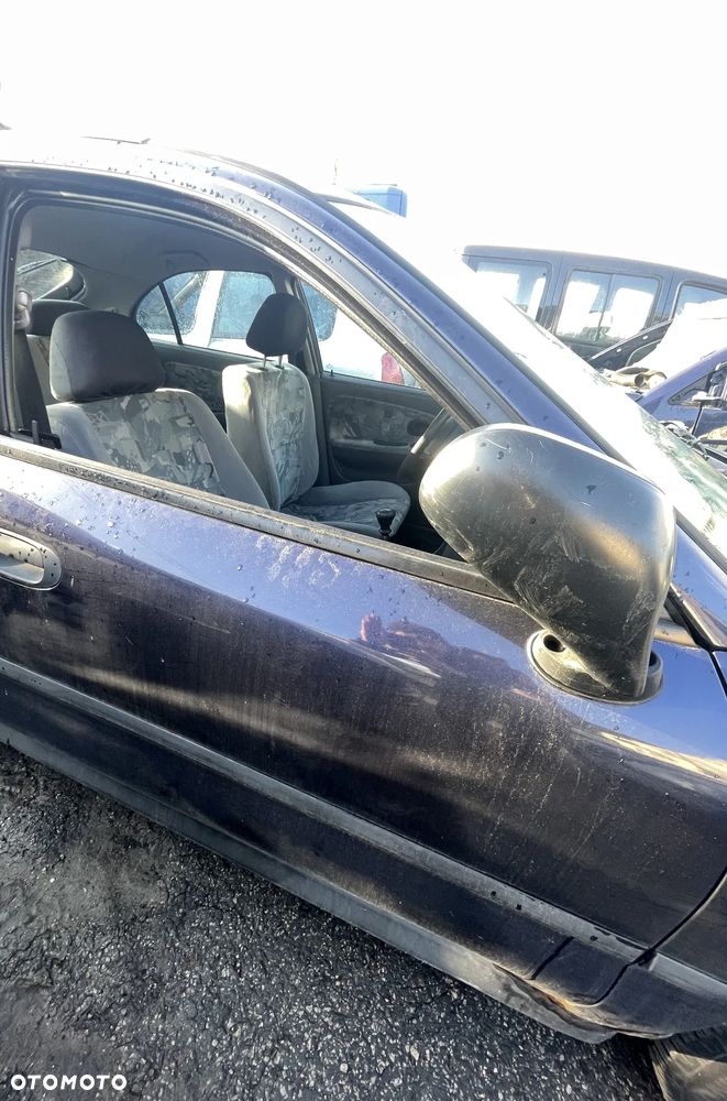 DRZWI PRAWY LEWY PRZOD MITSUBISHI CARISMA T46 - 1