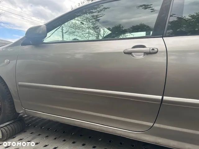 TOYOTA COROLLA E12 3D DRZWI LEWE ZAMEK BOCZEK OGRANICZNIK - 1