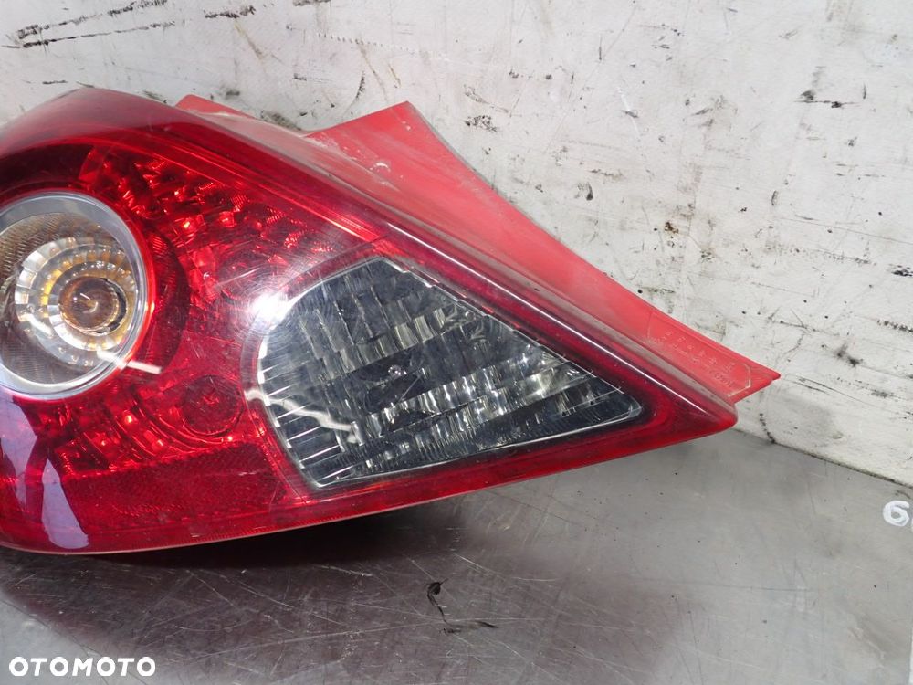 LAMPA LEWA TYLNA OPEL CORSA D 1.3CDTI 13211840 - 2