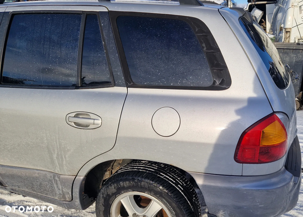 HYUNDAI SANTA FE I 00-06 BŁOTNIK LEWY TYŁ  LL