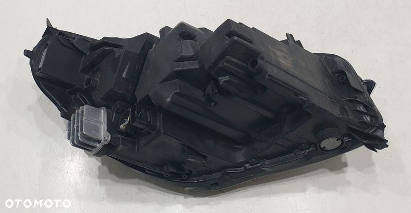 Opel Corsa Reflektor Lewy 9829522780 - 3