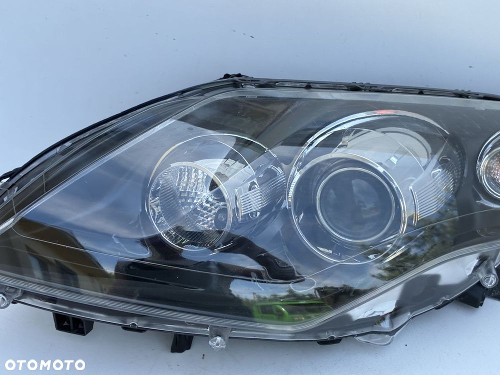 RENAULT LAGUNA III 07-15 LAMPA PRZÓD PRZEDNIA LEWA  EU 26060076R  89902288 - 5