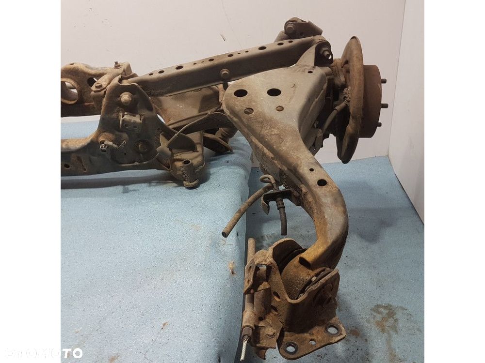 NISSAN QASHQAI I LIFT 2.0B BELKA ZAWIESZENIA TYŁ - 9