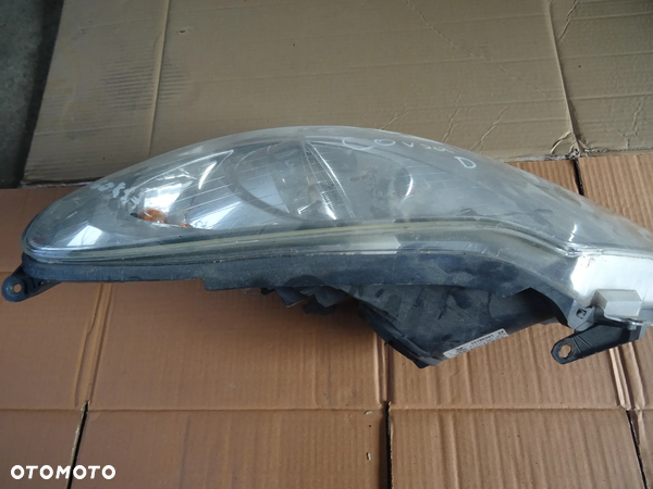 Lampa Opel Corsa D lewy przód