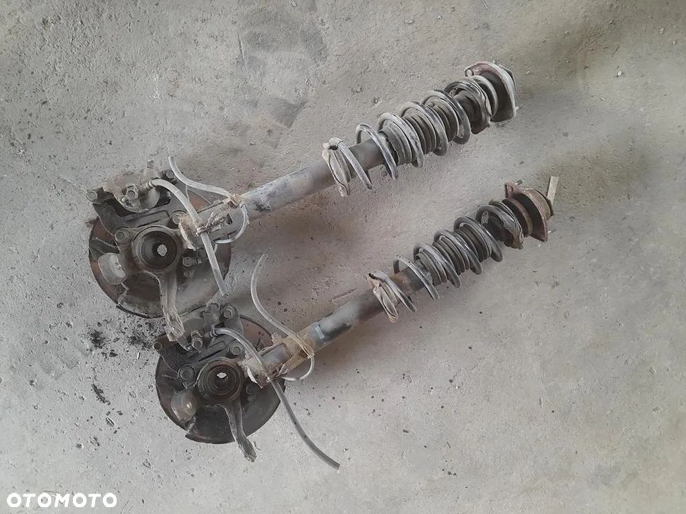 Amortyzator zwrotnica Macpherson Lewy prawy przod Justy IV 4 Sirion II 1.0b - 7