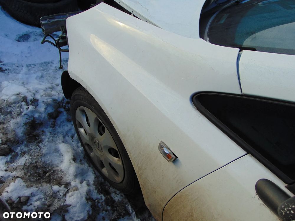 BŁOTNIK LEWY PRZÓD PRZEDNI OPEL CORSA D Z474 - 1