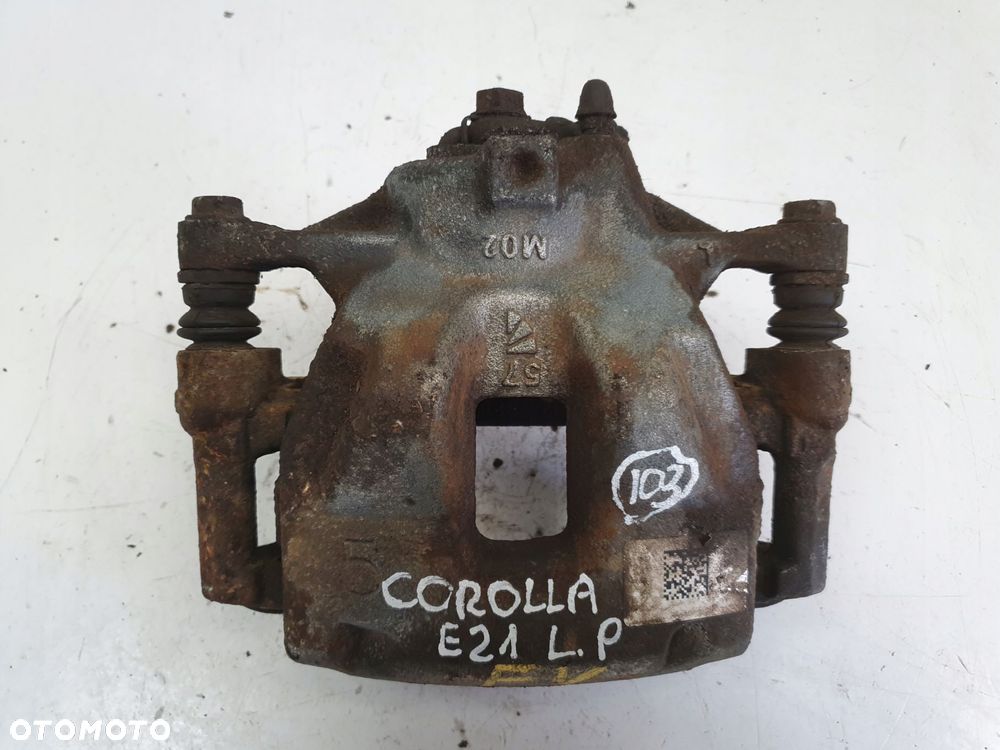 Toyota Corolla XII E21 PRAWY PRZEDNI ZACISK HAMULCOWY przód PASAŻERA - 1