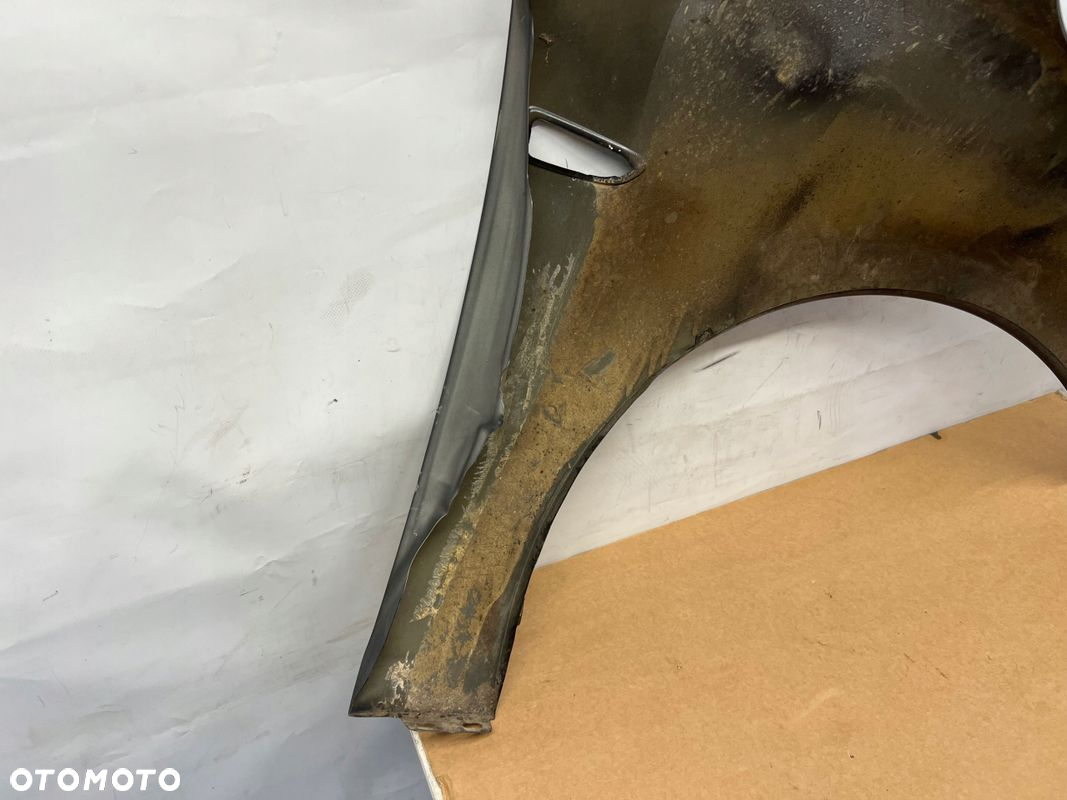 Opel Astra IV błotnik lewy przód przedni - 8
