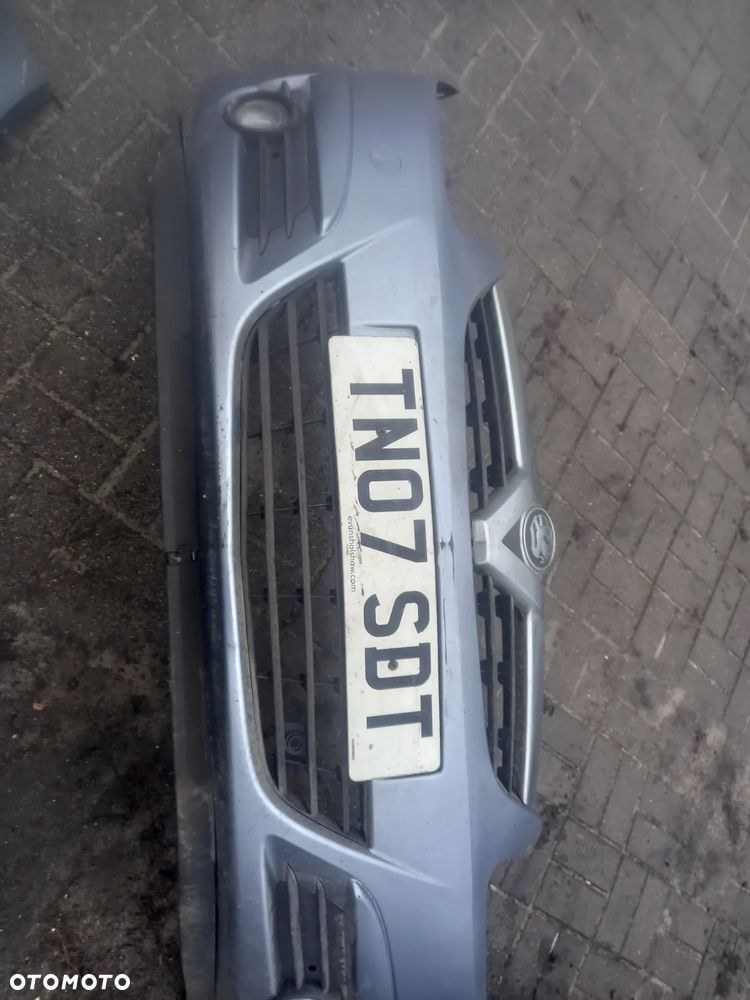 OPEL CORSA D ZDERZAK PRZOD SREBRNY HALOGENY