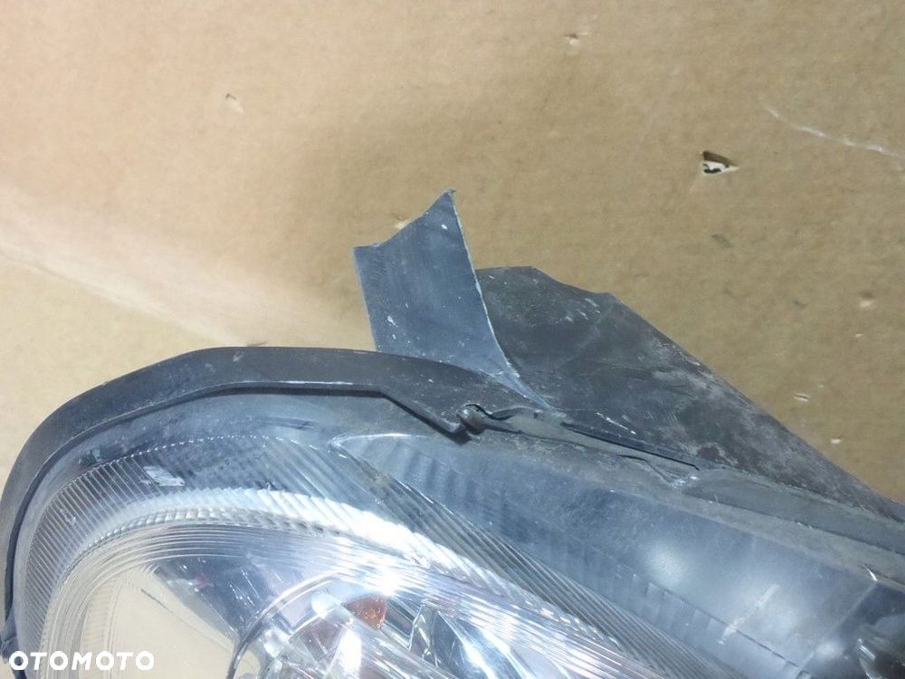 Fiat Grande Punto III Reflektor Lewy 89101387 - 4