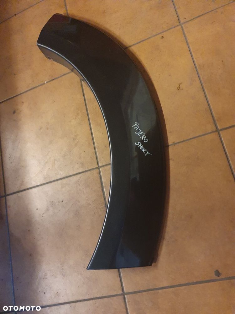 NAKŁADKA BŁOTNIKA MITSUBISHI PAJERO SPORT LEWA TYLNA 99-06 KOD A75 - 2