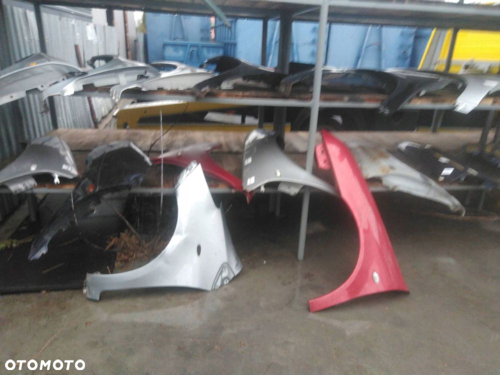 BŁOTNIK LEWY PRZÓD TOYOTA YARIS II LIFT 1F8 - 6